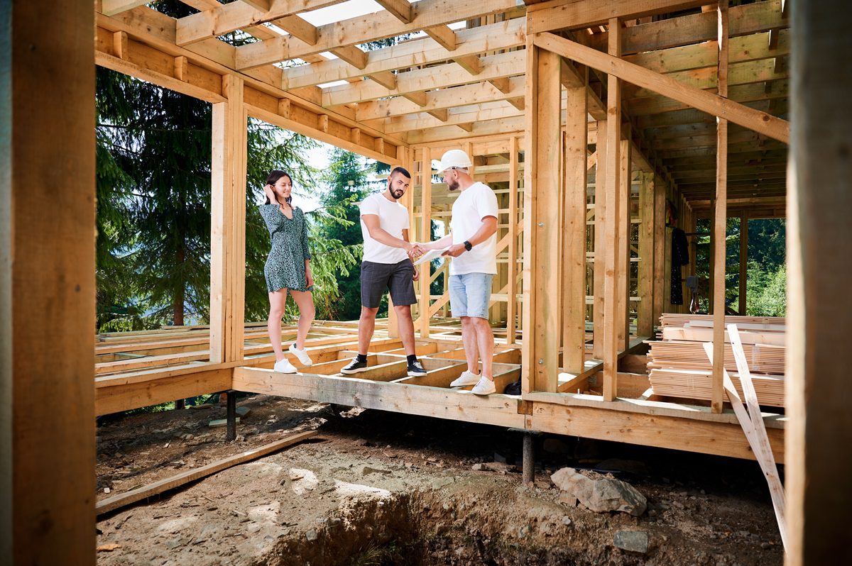 Homeowners and a contractor in a home under construction