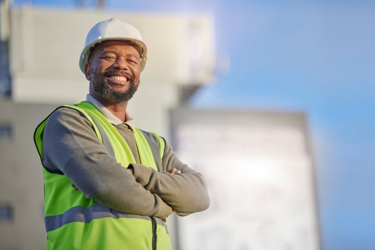 portrait of a property developer standing and smiling